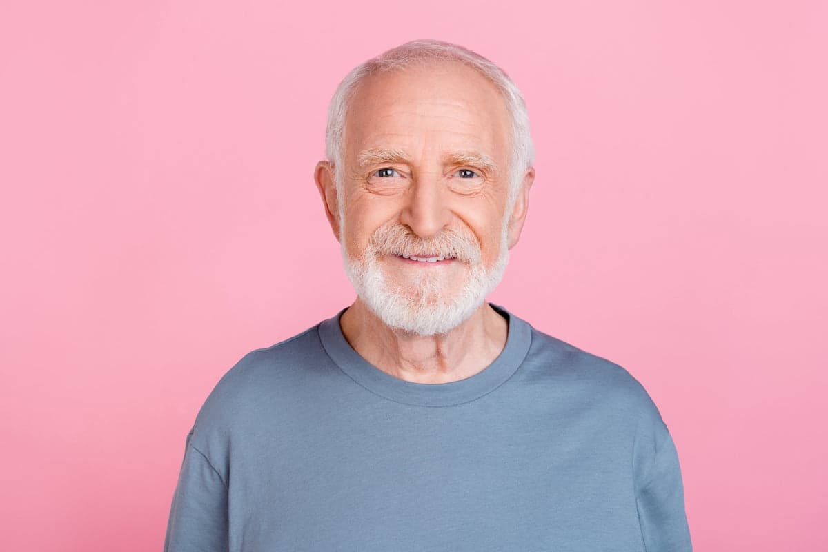 Headshot on a pink studio backdrop