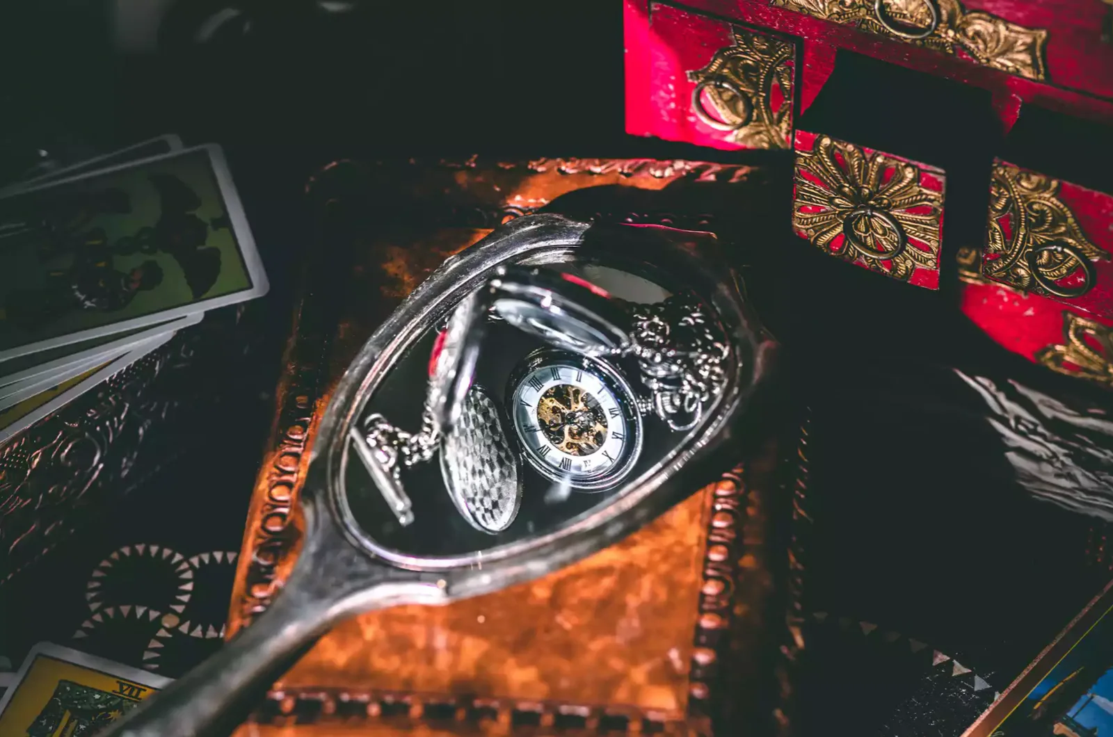 Ornate spoon on red brocade fabric