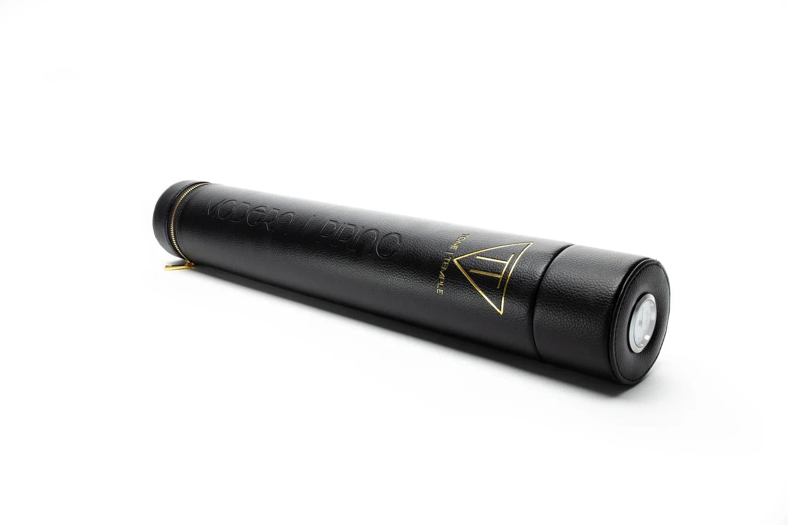 Black tube case with its lid off on a white background